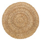 The Straw Loop Placemat Collection by Juliska features round, handwoven placemats crafted from natural rattan fibers with concentric circles and a beautiful, organic texture.