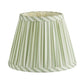 The Addison Ross Empire and Scalloped Lampshade features a pleated, cone shape with light green and white striped fabric trim on the top and bottom edges, designed for an E14 bulb holder.