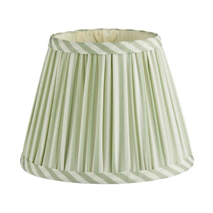 The Addison Ross Empire and Scalloped Lampshade features a pleated, cone shape with light green and white striped fabric trim on the top and bottom edges, designed for an E14 bulb holder.