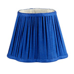 The Addison Ross Empire and Scalloped Lampshades feature a blue pleated design with a white interior, making them an elegant match for any rechargeable lamp base or E14 bulb holder.