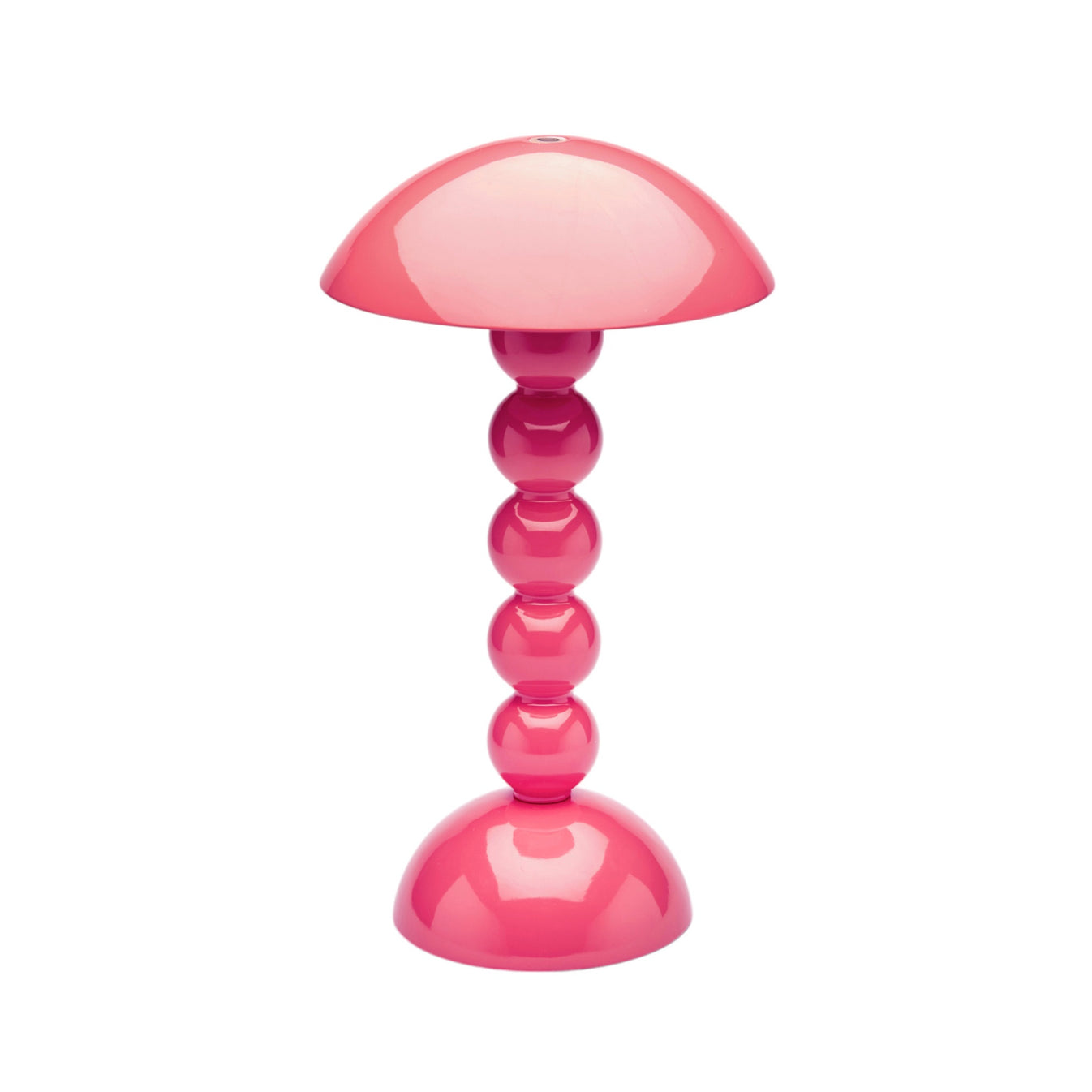 The Addison Ross Bobbin LED Cordless Lamp features a modern pink dome-shaped shade and stacked bobbin-style base, offers adjustable light levels, and is shown against a plain white background.