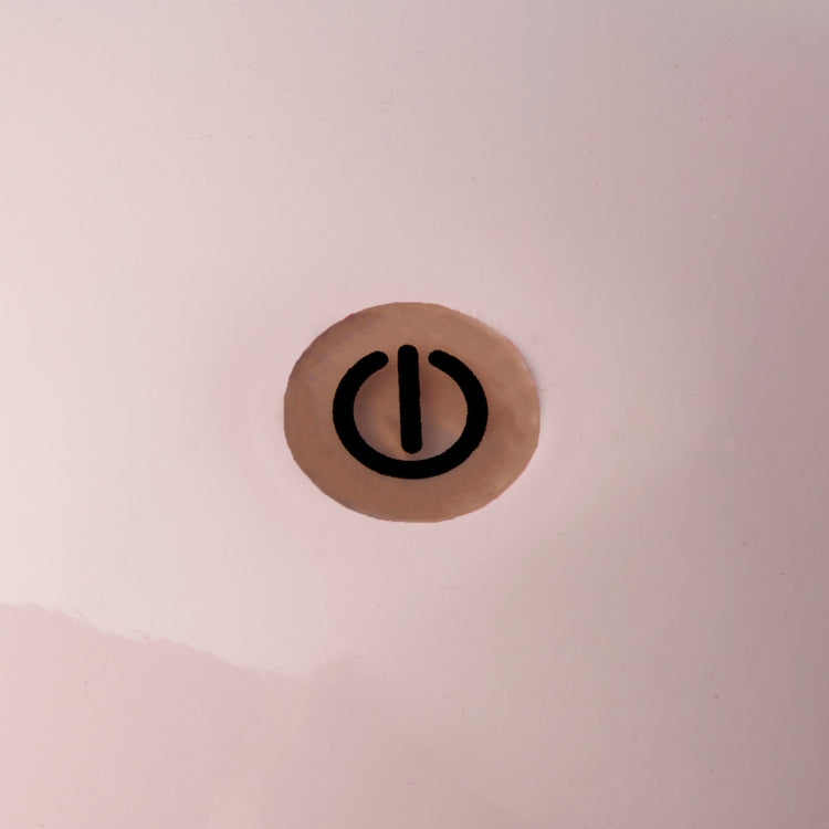 The Addison Ross Bobbin LED Cordless Lamp features a black power symbol in a light brown circle on a pale, smooth base, offering adjustable brightness—perfect for portable lighting.