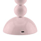 Close-up of the base of the Addison Ross Bobbin LED Cordless Lamp in pink, showing a USB-C charging port. This stylish portable lamp offers adjustable light levels to suit any mood.