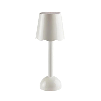 The Addison Ross Scallop LED Lamp, a cordless bedside light with a white scalloped shade, cylindrical stem, and rounded base, is shown against a plain white background.