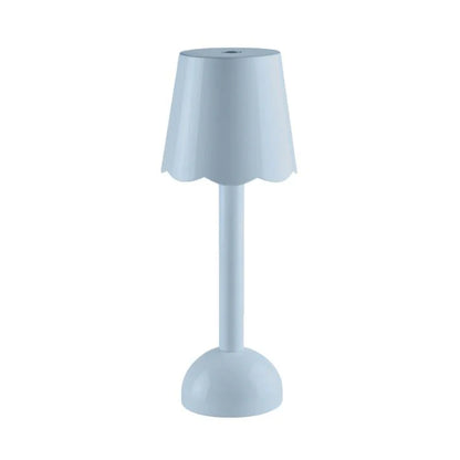 The Addison Ross Scallop LED Lamp is a modern, cordless bedside light featuring a scalloped-edge shade and round base, displayed against a plain white background.