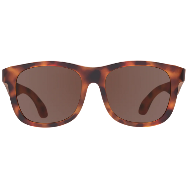 A pair of Babiators Limited Edition: Totally Tortoise Navigator sunglasses with UV400, shatter-resistant lenses.