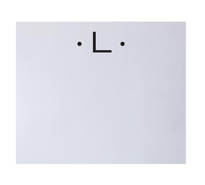 The Black Initial Large Notepad by Black Ink features a minimalist face design—two black dots and a right angle—printed on luxurious paper, making it a refined addition to your fine stationery collection.