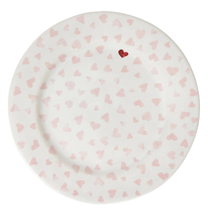 The Juliska Love You More Dessert/Salad Plate features a white ceramic design with pink hearts and a standout red heart near the rim, adding charming detail to your table setting.