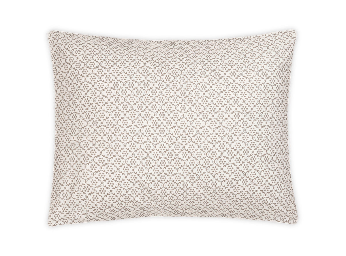 Rectangular pillow from the Laksha Bedding Collection by Matouk, featuring a white background with a repeating geometric brown dot pattern inspired by Indian block printing, displayed against a plain white backdrop.