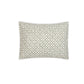 From the Laksha Bedding Collection by Matouk, this rectangular pillow features a white background adorned with a green geometric pattern inspired by traditional Indian block printing, shown against a plain white backdrop.