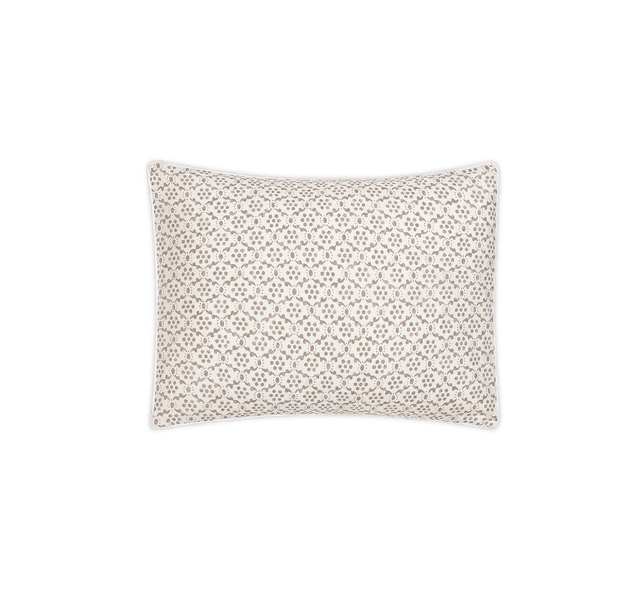 Rectangular pillow from the Matouk Laksha Bedding Collection, featuring a beige and white geometric lattice pattern inspired by traditional Indian block printing, viewed from above against a plain white background.