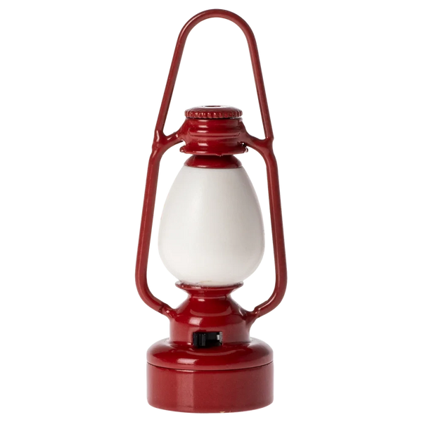 The Maileg Vintage Lantern, Mouse - Red is a charming red and white miniature lantern with a metal handle on top and a glass enclosure.