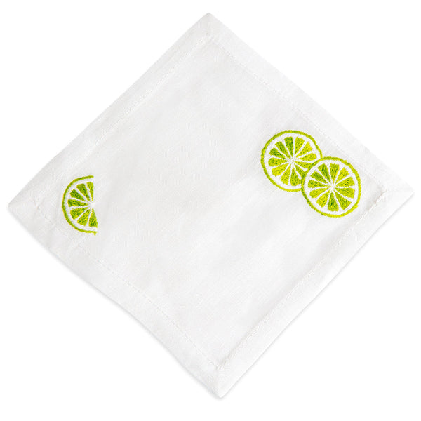 White linen cloth napkin, hand embroidered with Haute Home Lime Slice Coasters decoration, set of 4 pieces, isolated on a white background.