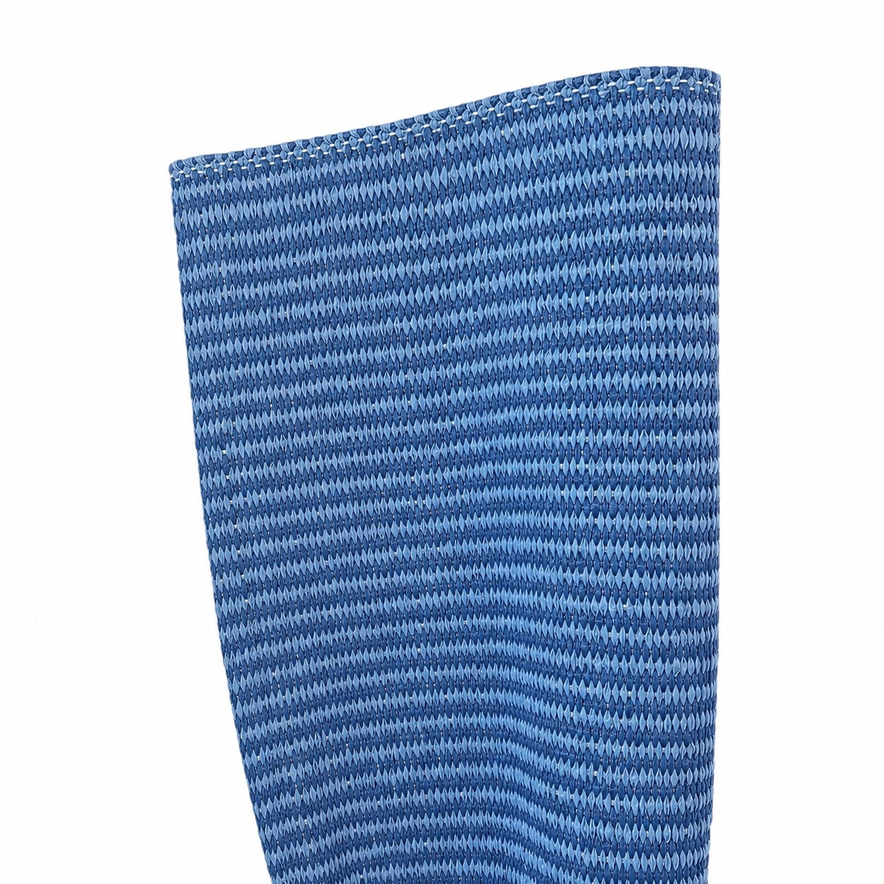 Close-up of the Magdalena York Lina Strie Rug, featuring blue vinyl fiber with horizontal stripes and visible top-edge stitching—ideal for indoor or outdoor use.