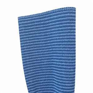 Close-up of the Magdalena York Lina Strie Rug, featuring blue vinyl fiber with horizontal stripes and visible top-edge stitching—ideal for indoor or outdoor use.