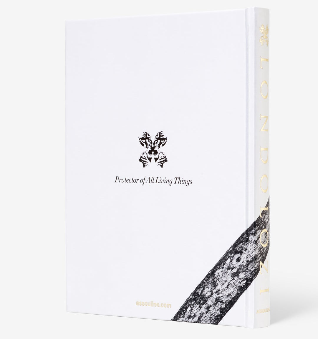 Assouline’s “Londolozi: The Safari that Changed Everything” is a white hardcover book featuring a black emblem, the phrase “Protector of All Living Things,” and a tree bark pattern evoking wilderness, conservation, and community development.