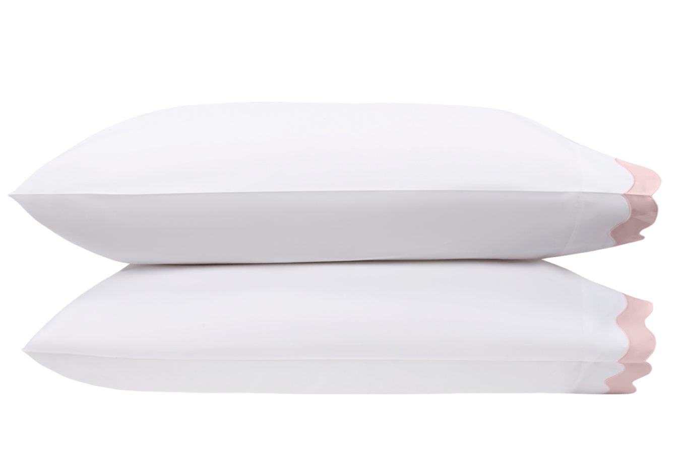 Two white pillows from the Matouk Lorelei Bedding Collection, Pink, crafted from luxurious 600 thread count cotton with pink scalloped edges, are stacked on a white background. OEKO-TEX® certified for safe, quality comfort.