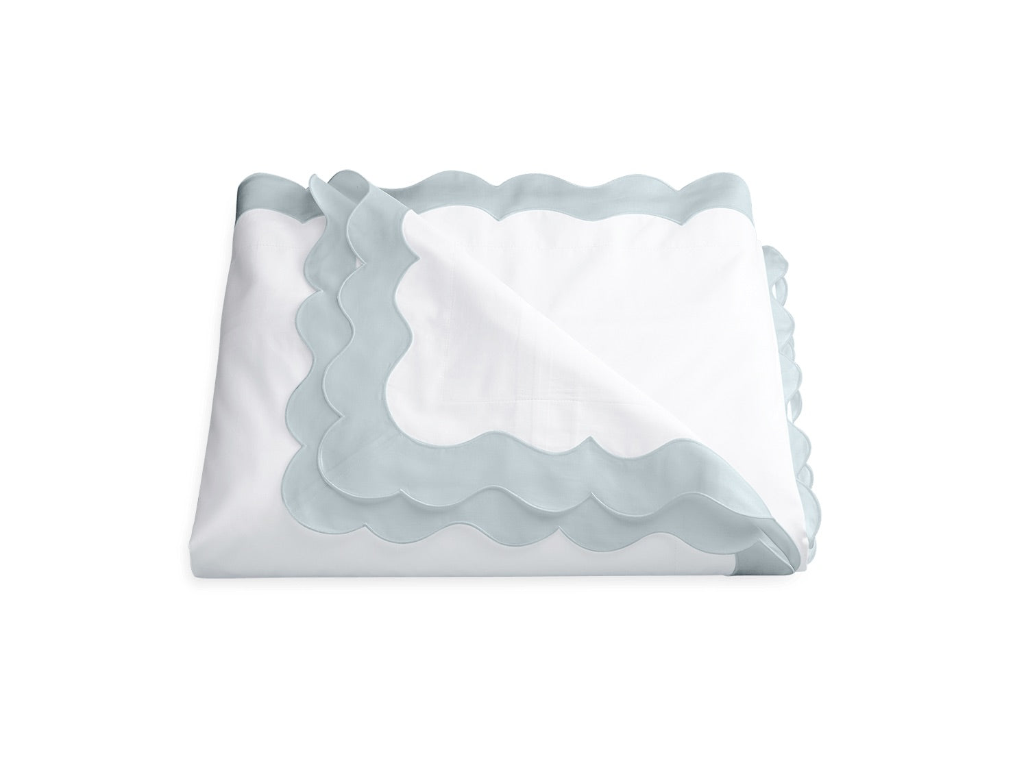 A folded white sheet from the Lorelei Bedding Collection by Matouk, featuring a light blue appliqué scallop border and crafted from luxurious 600 thread count Egyptian cotton, displayed against a plain white background.