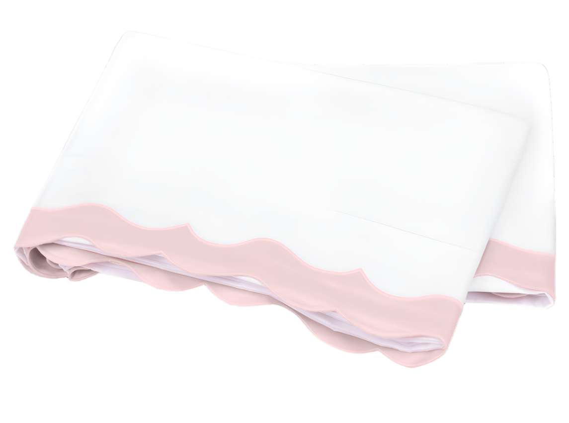 Folded white bedsheet with light pink scalloped trim from the Matouk Lorelei Bedding Collection, crafted from 600 thread count Milano Egyptian cotton. OEKO-TEX® certified and shown on a plain white background.