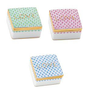 Three small, square Herend Love Boxes, each hand-painted in green, pink, or blue patterns with gold trim and “LOVE” on the lid—luxurious porcelain decor accents for your home.