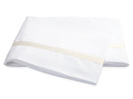 Two folded white bed sheets from the Lowell Bedding Collection by Matouk, featuring a subtle beige stripe near the edge. Expertly crafted from Egyptian cotton percale for exceptional softness and breathability, these luxurious sheets are displayed on a plain white background—perfect for elevating your home bedding experience.
