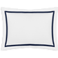 A white rectangular pillowcase from the Matouk Lowell Bedding Collection, Navy, features a dark blue border and is crafted from luxurious 600 thread count Egyptian cotton percale.