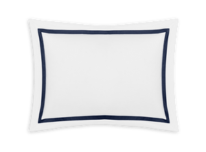 A white rectangular pillowcase from the Matouk Lowell Bedding Collection, Navy, features a dark blue border and is crafted from luxurious 600 thread count Egyptian cotton percale.
