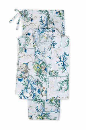 Matouk's Maotuk Luca Pajama Set features a floral and sea-themed pattern in luxurious cotton percale with a shirt and pants neatly folded alongside a matching drawstring bag.