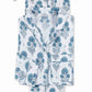 The Matouk Luca Pajama Set features a folded white cotton percale design with blue floral print, including a button-up collared top with front pocket and matching drawstring pants.