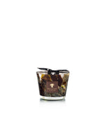 Baobab Collection Halona Yellow World hand-blown glass candle vessel with a swirling brown, gold, and black pattern, branded label, and black ribbon tied around the rim.