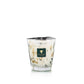 Baobab Collection Halona White World Candle in a hand-blown glass vessel filled with white wax and speckled with dark, leaf-like accents.