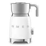 The SMEG Milk Frother Collection by Smeg includes a white milk frother with a stainless steel carafe, using an induction system for ideal heating. It features a multifunction knob and front control buttons, plus a right-side handle for easy use.