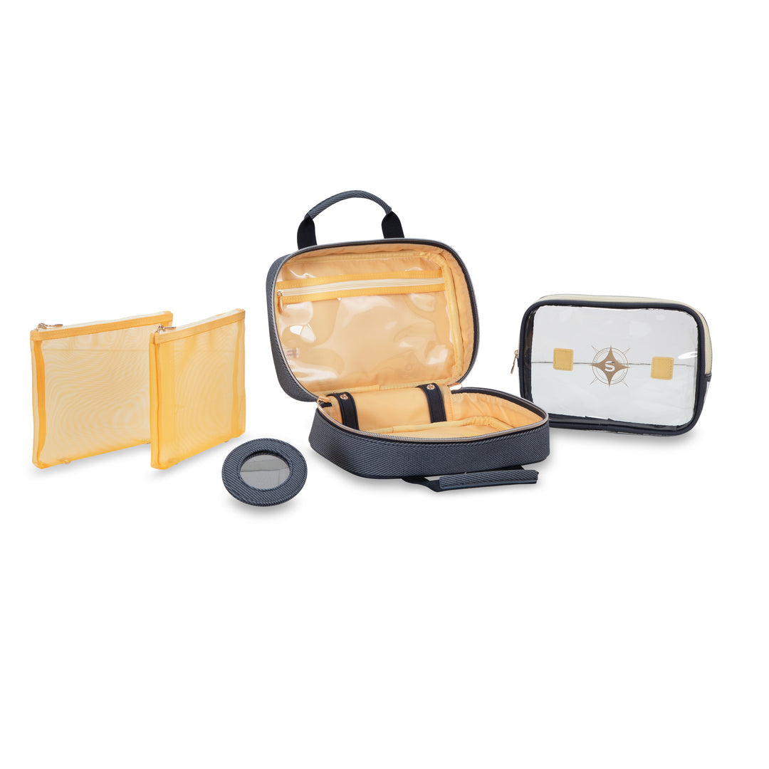 The Stephanie Johnson Denim Travel Collection includes a transparent pouch, two mesh pouches, an open compartment case, and a circular container—perfect as makeup bags or cosmetic organizers for travel.