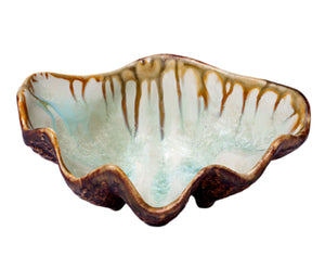 The Small Clam Bowl Collection by AE Ceramics features ceramic nut bowls with uneven, wavy rims, light blue-green interiors, and brown drip glaze accents along the edges, all crafted from natural materials.