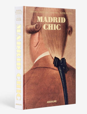 The cover of "Madrid Chic" by Assouline features an illustration of a person with a vintage hairstyle and hair bow, capturing Spanish cultural expression.