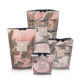 Four Baobab Collection Leaves Manon candles in hand-blown marbled pink, green, and white glass arranged by size on a white background. Features blackcurrant, rose, and sandalwood notes. Brand: Baobab.