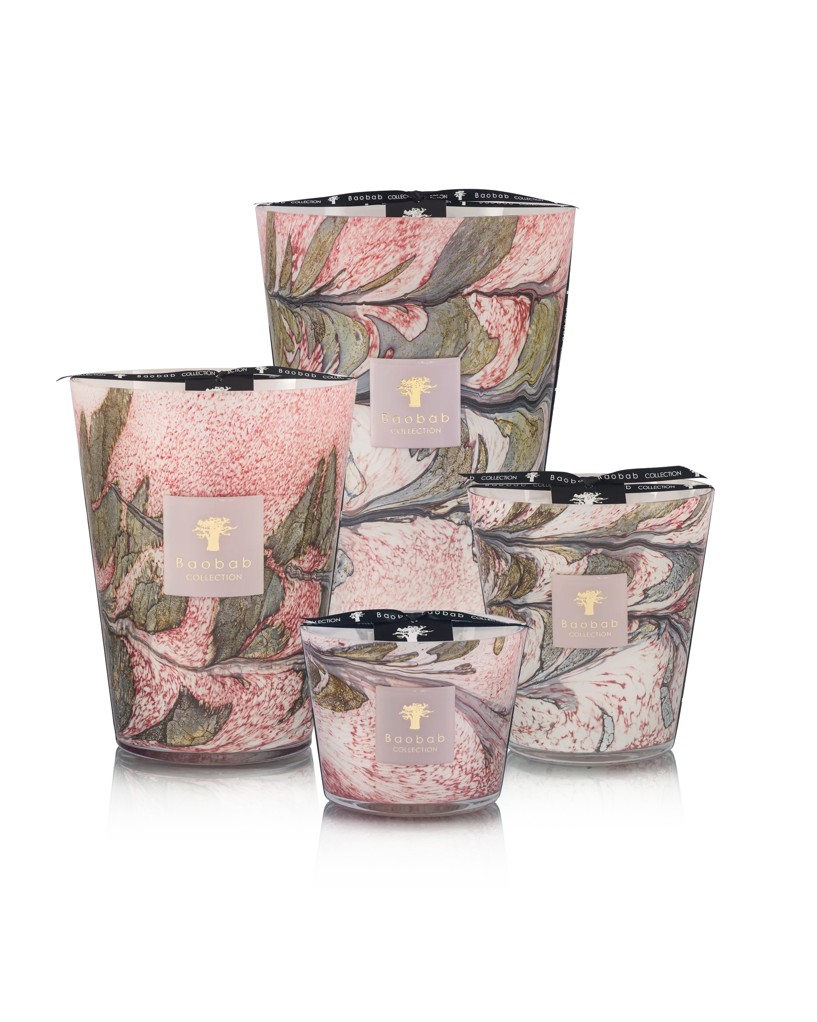 Four Baobab Collection Leaves Manon candles in hand-blown marbled pink, green, and white glass arranged by size on a white background. Features blackcurrant, rose, and sandalwood notes. Brand: Baobab.