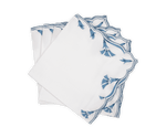 A set of four Marcella Napkins by Matouk, featuring white cloth with scalloped edges and blue embroidered leaf patterns, neatly stacked in a fanned arrangement on a white background.