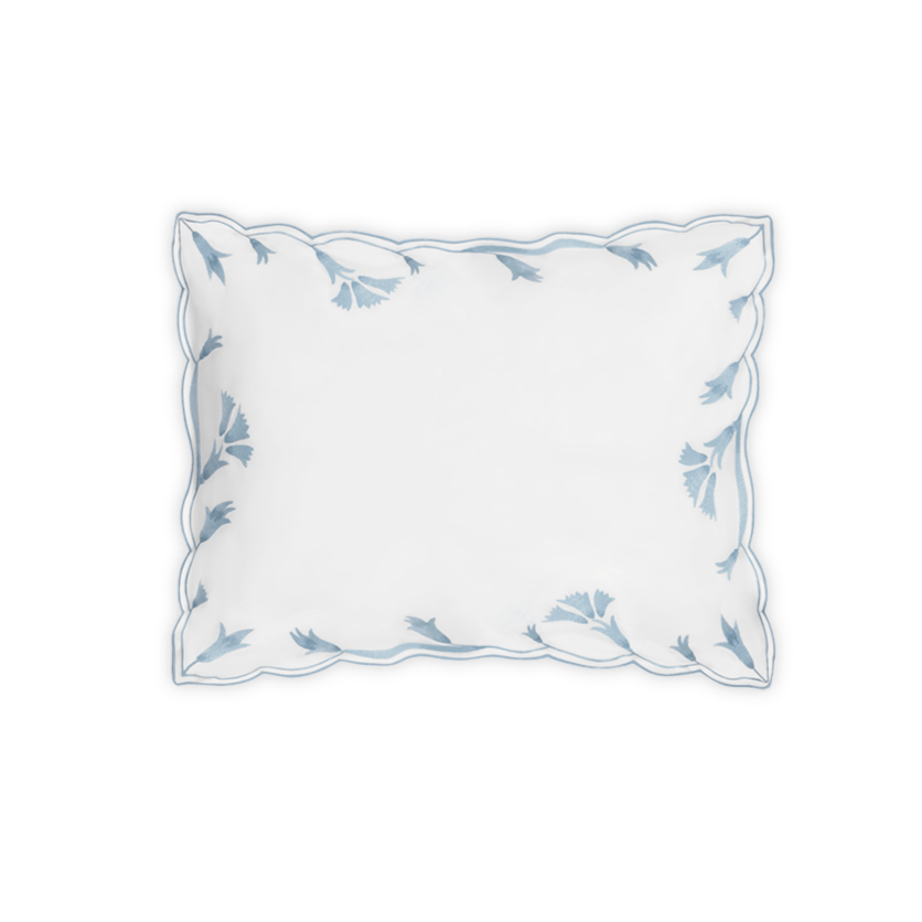 The Marcella Bedding Collection pillowcase by Matouk in Hazy Blue features light blue scalloped floral embroidery on white Nocturne sateen, shown against a plain white background.