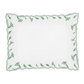 A white rectangular napkin with scalloped edges and a green leaf border, inspired by the Marcella Bedding Collection, Clover from Matouk.