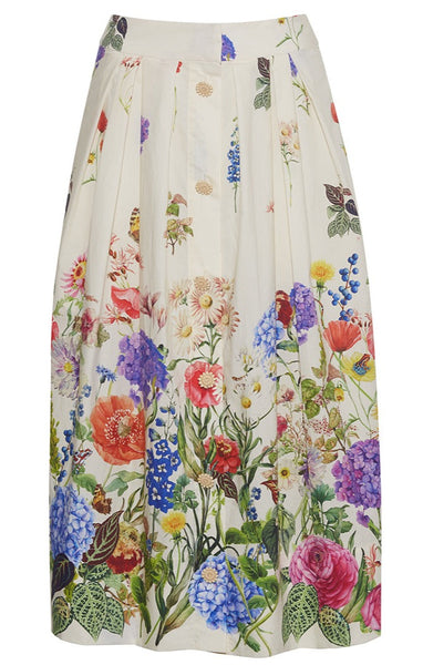 A high-waisted Cara Cara Marge skirt made from cotton poplin, adorned with flowers.