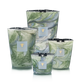 Four Baobab Collection Leaves Marius Candles by Baobab, in green and white marbled hand-blown glass, are arranged together against a plain background.