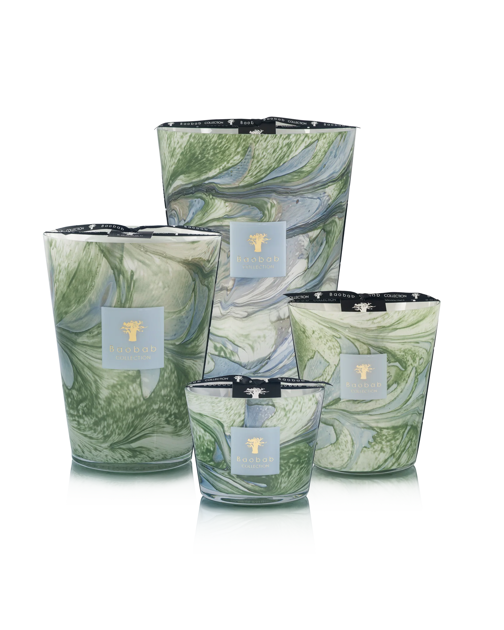 Four Baobab Collection Leaves Marius Candles by Baobab, in green and white marbled hand-blown glass, are arranged together against a plain background.