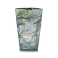 The Baobab Collection Leaves Marius Candle features a tall, hand-blown marbled green, blue, and white glass container with the Baobab label, embodying the serene essence of Provence.