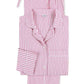 The Matteo Pajama Set by Matouk features pink and white seersucker cotton stripes, a button-up top with collar and breast pocket, plus a matching drawstring pouch—all laid out flat.