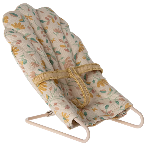 A Maileg Babysitter, Micro by Maileg featuring a floral patterned fabric seat and a yellow harness, supported by a minimalist metal frame.