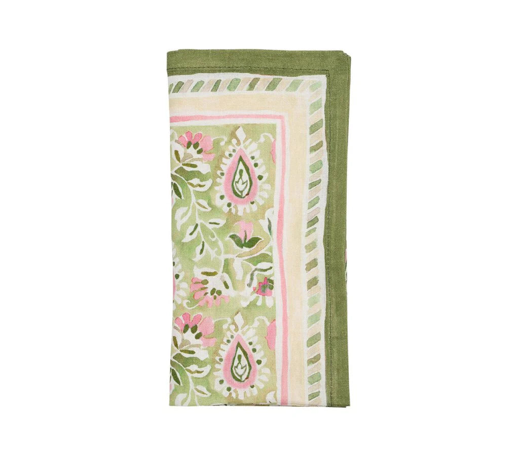 The Mira Napkin Set by Kim Seybert features folded linen napkins with a hand-painted green, pink, and white floral and paisley pattern, finished with striped borders.