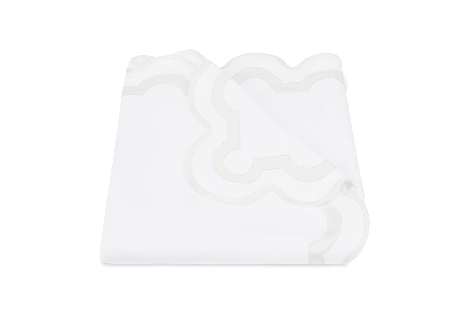 The Mirasol Bedding Collection by Matouk features a folded white bedsheet with a scalloped edge and subtle decorative trim, crafted in Italy from luxurious 600 thread count Egyptian cotton percale, displayed on a plain white background.