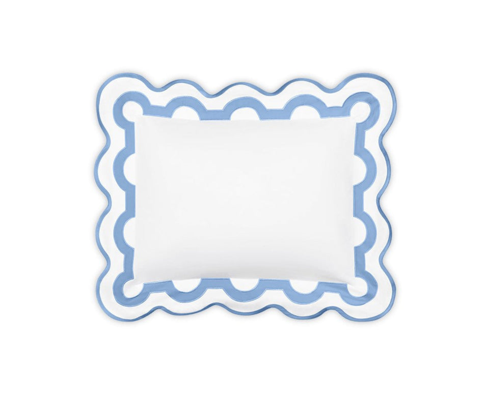 The Matouk Mirasol Bedding Collection, Azure, offers a rectangular white pillow made from luxurious Egyptian cotton percale, adorned with a decorative blue and white scalloped border.