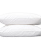 Two white pillows from the Matouk Mirasol Bedding Collection, crafted from luxurious Egyptian cotton percale, are stacked on top of each other against a plain white background.